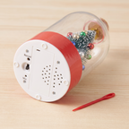 Underside of the base with record button, microphone, speaker and the red recording pin