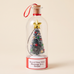Merry Message recordable Christmas message bottle with snowy tree, gold star and red label