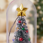 Close-up of the gold star and mini snowy Christmas tree inside the glass bottle